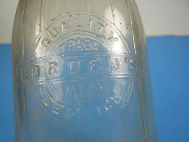 Glass milk bottle marked Bordens Farm Products Co. IL  