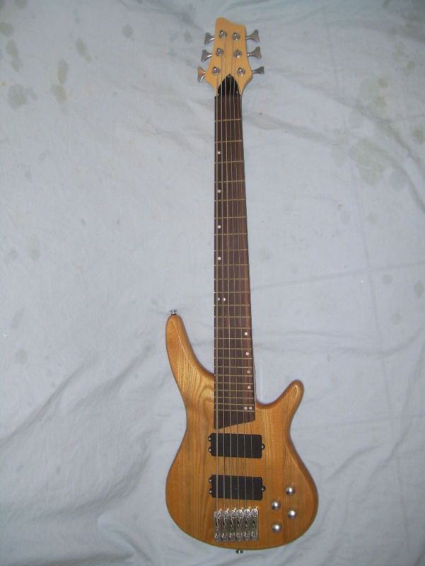 Bass Guitar, 6 String, solid wood body new  